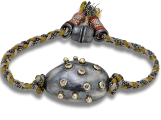 Handwoven bracelet with oxidized silver nugget studded with diamonds found at Patricia in Southern Pines, NC