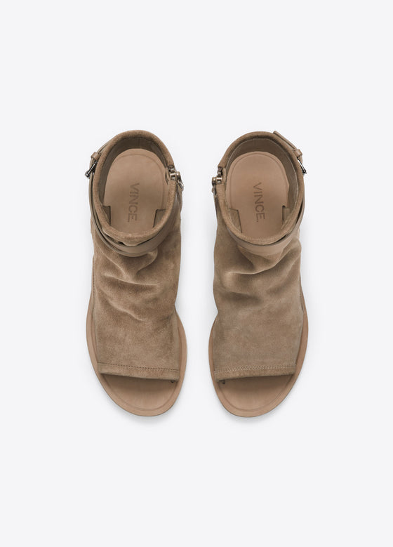 Vince Thalia Sport Suede Sandal, a bootie silhouette featuring cutouts along the toe, heel and sides of the foot.