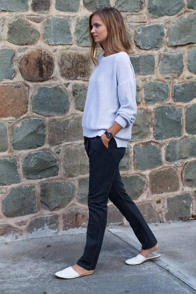 White cotton sweater over jeans
