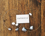 This light and airy necklace features two grey freshwater pearls on a wire choker. The wire is Sterling Silver.