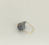 This simply elegant ring consisting of a single baroque freshwater pearl floating on a wire