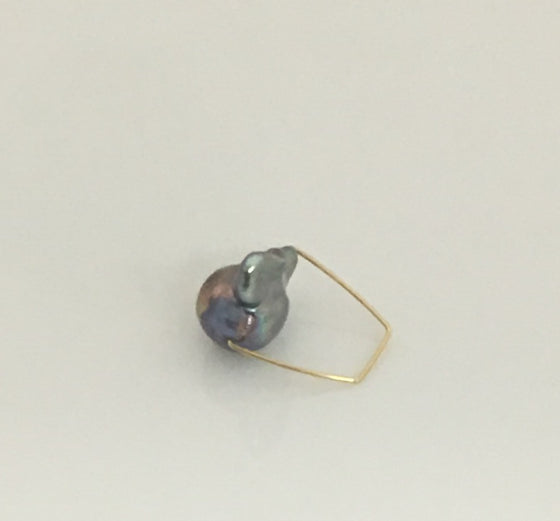 This simply elegant ring consisting of a single baroque freshwater pearl floating on a wire