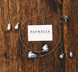 This light and airy necklace features two grey freshwater pearls on a wire choker. The wire is Sterling Silver with 22kt gold vermeil.