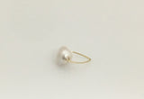 This simply elegant ring consisting of a single baroque freshwater pearl floating on a wire.