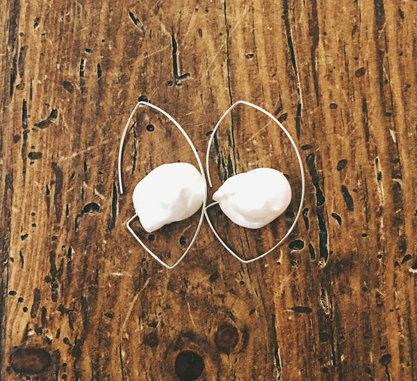 These simply elegant earrings consisting of a single baroque freshwater pearl floating on a wire.