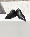 Black leather slides from Kallmeyer