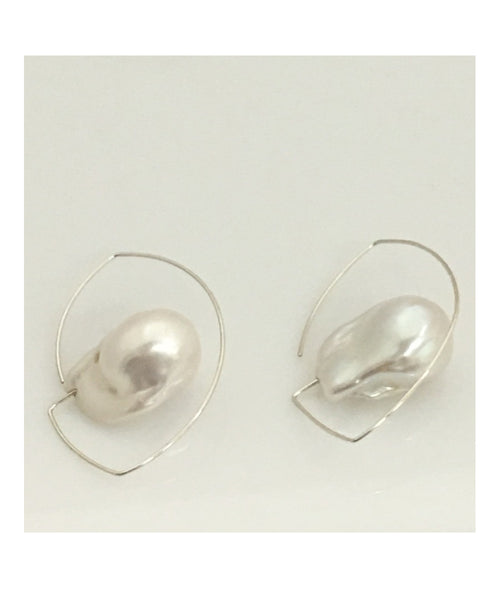 These simply elegant earrings consisting of a single baroque freshwater pearl floating on a wire.