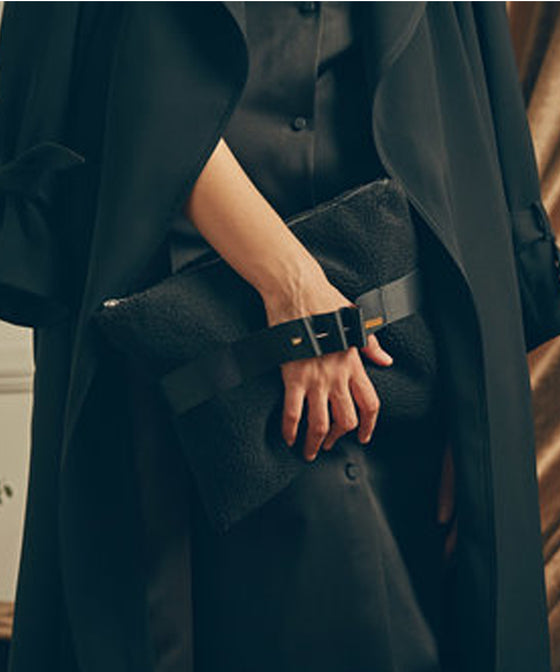 Black shearling clutch with grosgrain ribbon found at Patricia in Southern Pines, NC