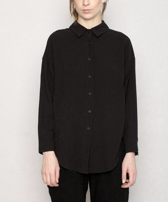 Signature Dolman Shirt in Black. The perfect black everyday shirt. An easy, tailored fit with dolman sleeves and slightly tapered body give you room to move freely without submitting to a boxy shape. 