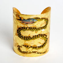 Beautiful Evocateur gold leaf cuff, featuring a serpent eating a fish, available at Patricia