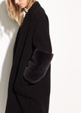 Close up of women's black wool coat by Vince