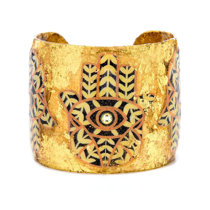Beautiful Evocateur gold cuff adorned with Hamsas image, available at Patricia