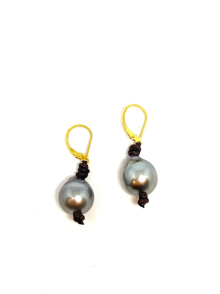 Perle by Lola Tahitian pearl earrings on leather found at Patricia in southern pines, nc